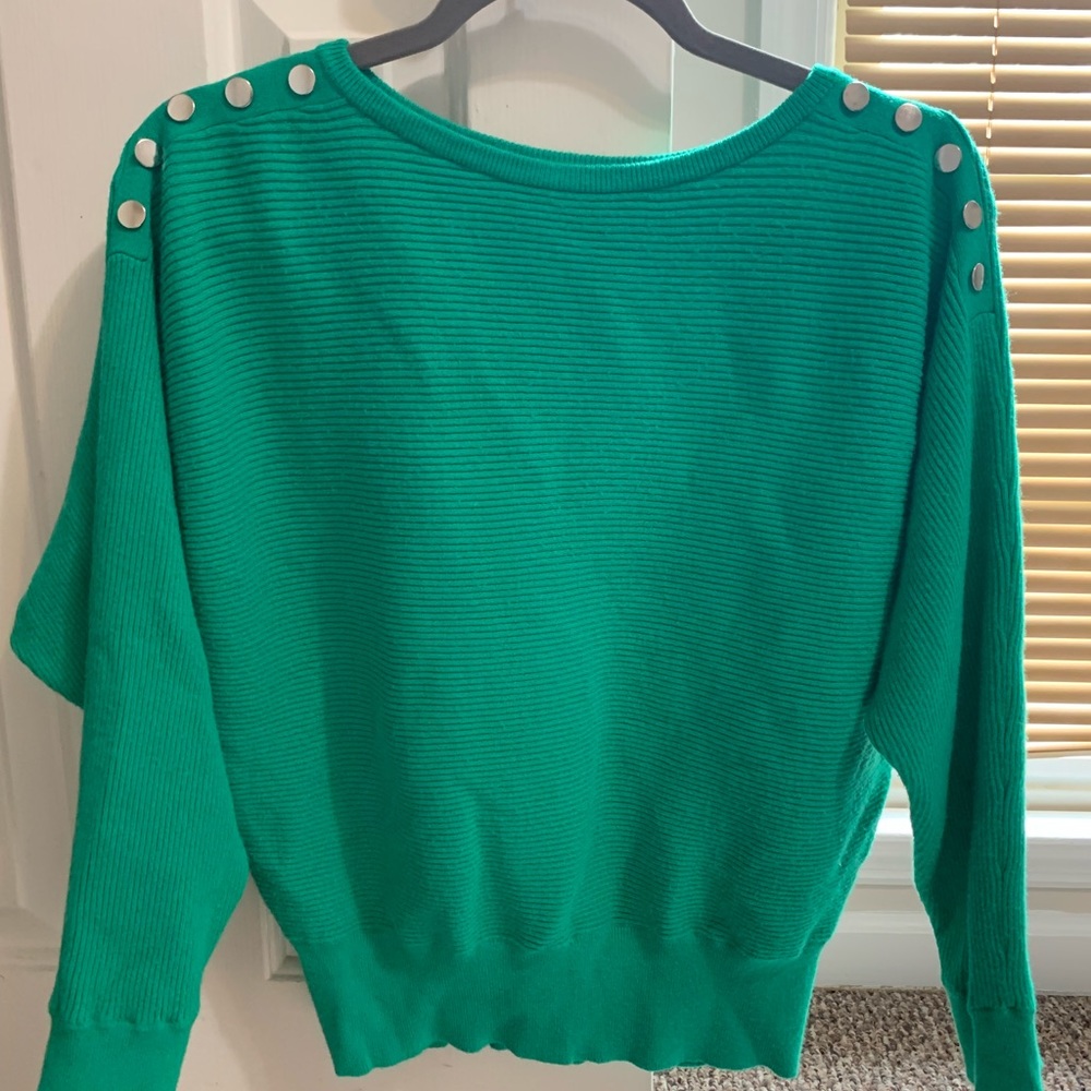 Green sweater with silver buttons